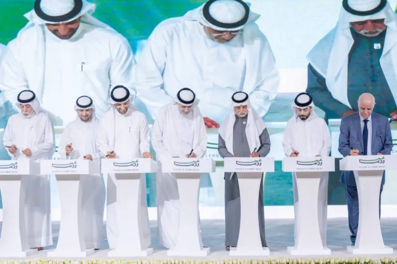 Sheikh Sultan bin Mohammed bin Sultan Al Qasimi, Crown Prince of Sharjah, signing the 'Ahd wa Waad' document at the Jawaher Centre for Events and Conferences.