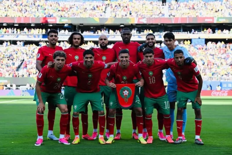 Morocco national football team celebrating after achieving their best-ever sixth-place FIFA world ranking during the 2026 World Cup.