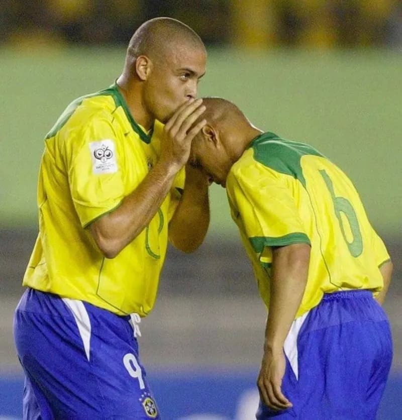 Ronaldo Nazário kisses Roberto Carlos on the head during Brazil's 3-1 win over Argentina at the Mineirão stadium in June 2004.