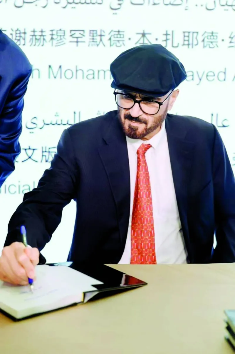 His Excellency Dr. Jamal Sanad Al Suwaidi signing copies of his two latest books at the UAE pavilion of the Beijing International Book Fair 2026.
