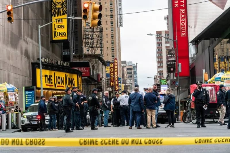 A view of Times Square in New York City following a shooting incident that prompted a security response and panic among pedestrians.