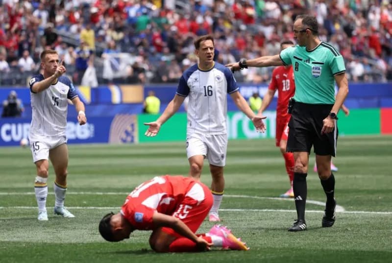 A wide-angle view of a 2026 FIFA World Cup group stage match in progress, with players competing on the pitch in a packed stadium.