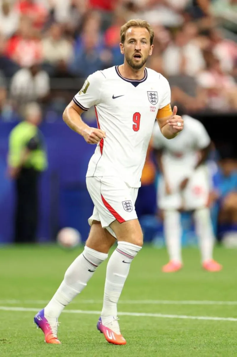 Harry Kane celebrating with England fans after the team's 4-2 World Cup victory over Croatia.