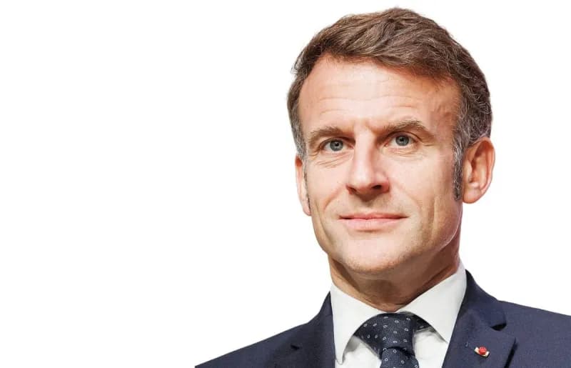 French President Emmanuel Macron speaking at a podium, reacting publicly to the UAE Cabinet's decision setting a minimum age of 15 for social media use.