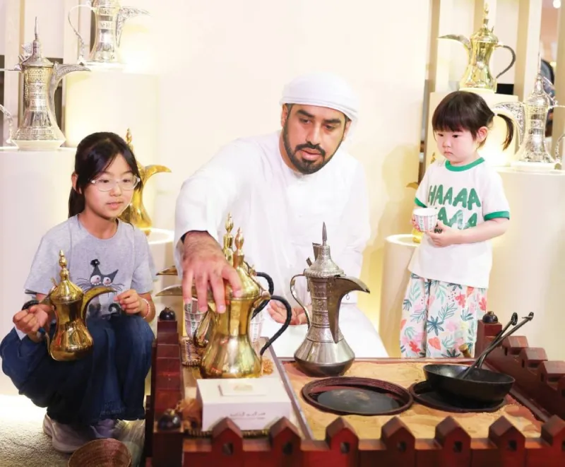 Emirati craftswomen display traditional Sadu weaving and heritage perfumes at the UAE pavilion during the 2026 Beijing International Book Fair.