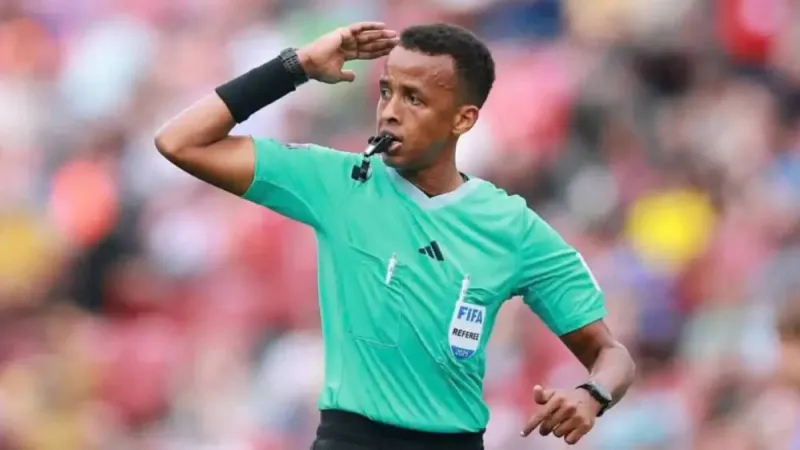 Somali international referee Omar Artan on the pitch during a football match.