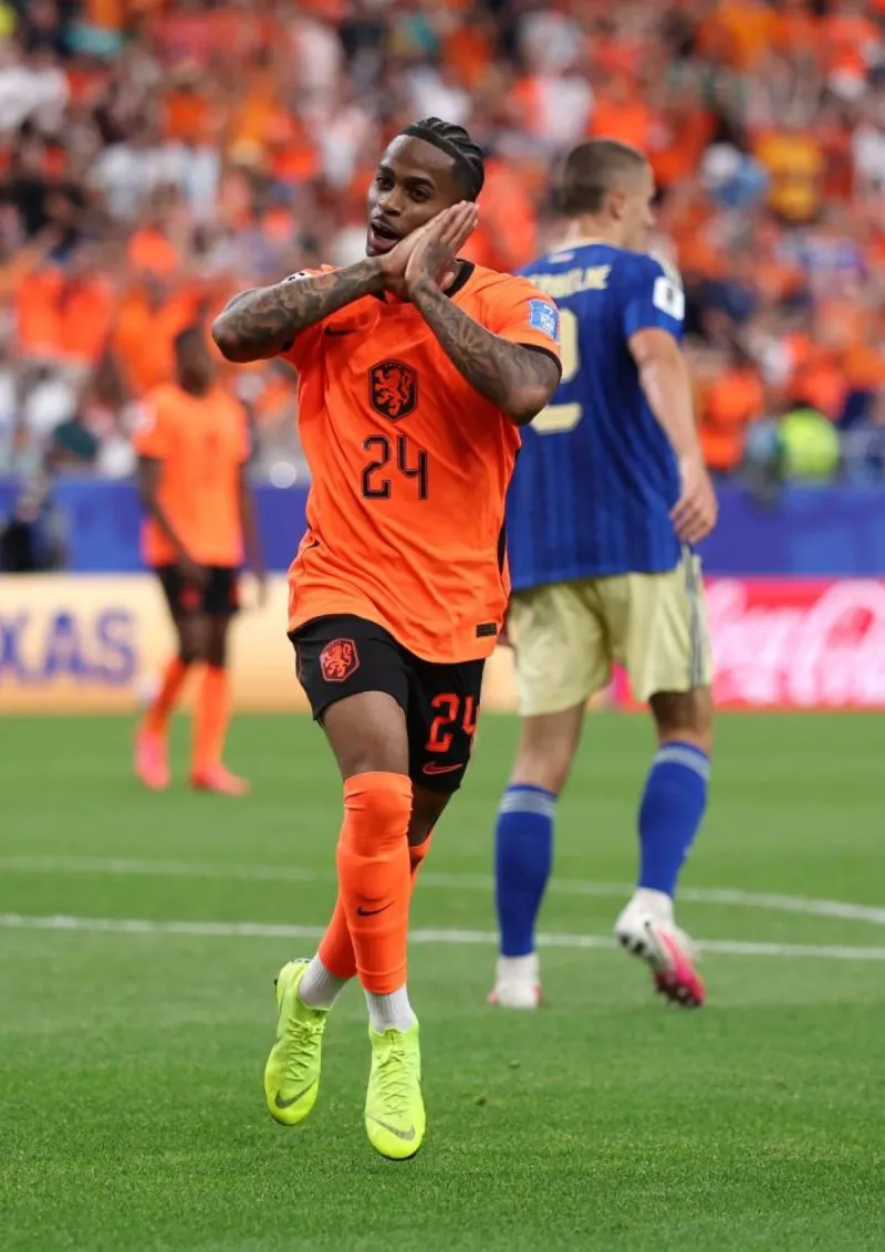 Netherlands players celebrate during their 5-1 World Cup Group 6 victory over Sweden.
