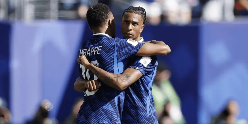 Kylian Mbappé and Michaël Olise celebrate together during France's 3-1 opening win over Senegal at the 2026 World Cup.