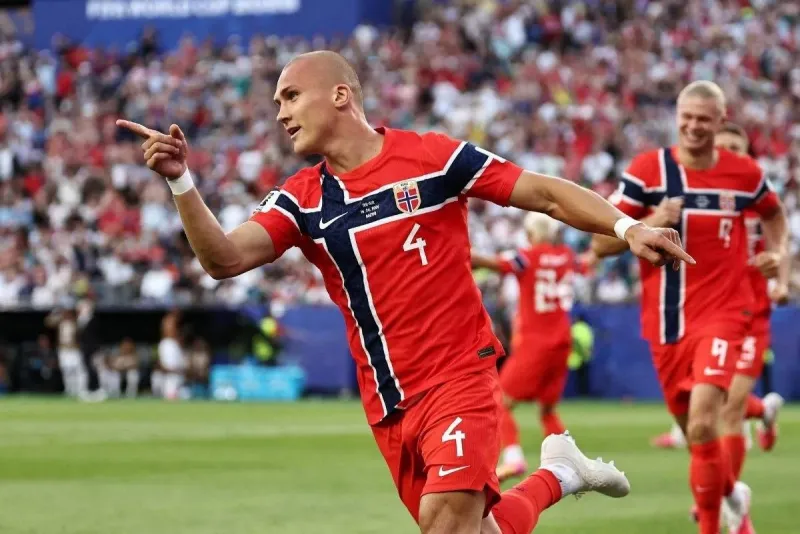 Norway defender Leo Østigård celebrating after scoring a headed goal during Norway's opening 2026 World Cup match against Iraq.