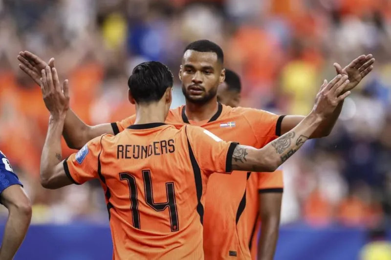 Netherlands players celebrate a goal during their 5-1 World Cup group stage victory over Sweden at a stadium in Houston.