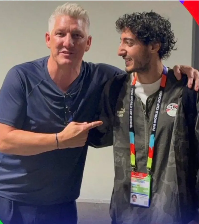 Mohamed Hani, Egypt's right back, poses for a commemorative photo with German football legend Bastian Schweinsteiger following Egypt's 1-1 draw with Belgium at the 2026 FIFA World Cup.
