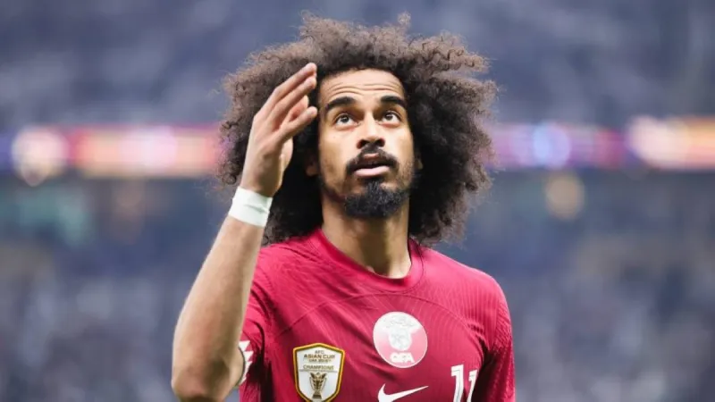 Qatar national team star Akram Afif bent over with a ball bearing the Qatar Football Association crest on his back, in the Instagram post he later deleted.