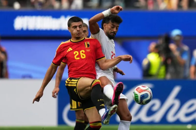 Belgium players in dejection after failing to score against Iran in their 2026 World Cup group stage match.