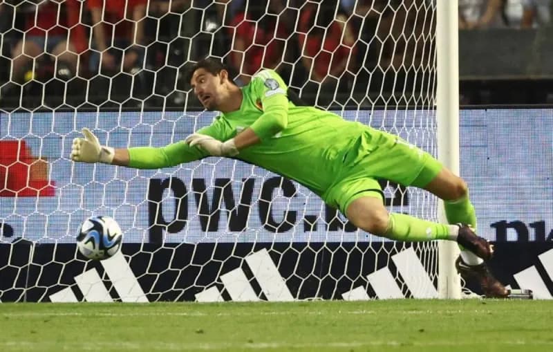 Thibaut Courtois in action as Belgium's goalkeeper during the 2026 World Cup group stage match against Iran.