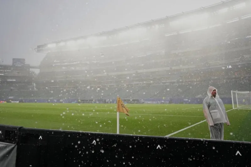 Spain's players walking off the training pitch in Chattanooga, Tennessee, as a thunderstorm forces the cancellation of their World Cup training session.