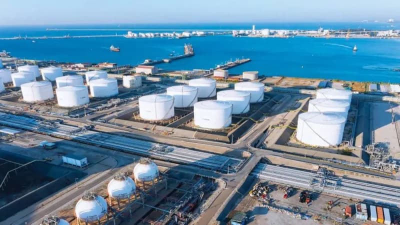 Container ships and oil tankers navigate the Strait of Hormuz, the strategic waterway through which a fifth of the world's fuel exports normally pass.