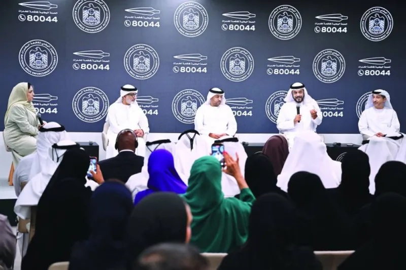 A panel discussion session at the launch of the National Anti-Narcotics Campaign titled 'National Upbringing System', with participants seated on a stage addressing ways to protect UAE youth from drug addiction.