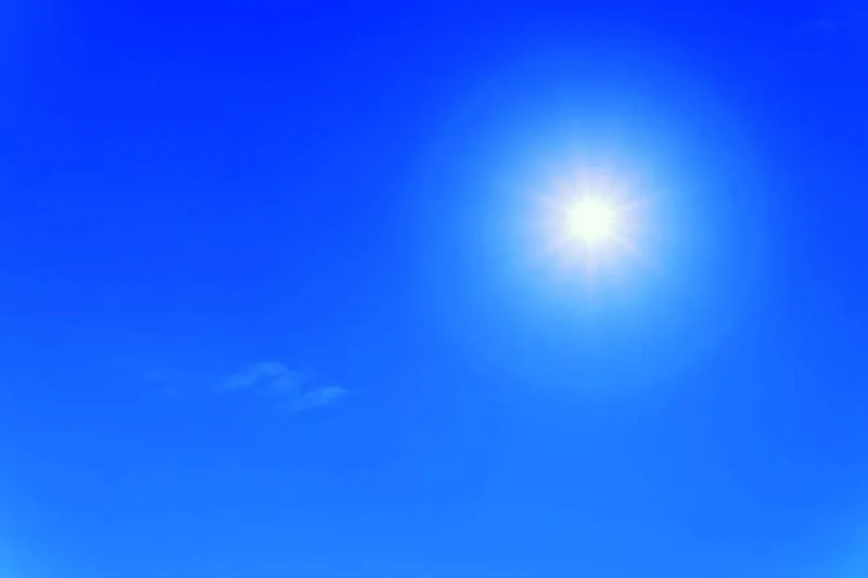 A person walking outdoors in natural daylight, illustrating the link between sun exposure and reduced dementia risk.