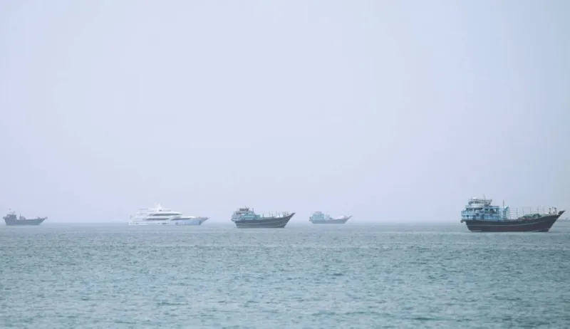 A vessel navigates through the Strait of Hormuz amid heightened tensions over Iranian threats to impose transit fees or close the strategic waterway.