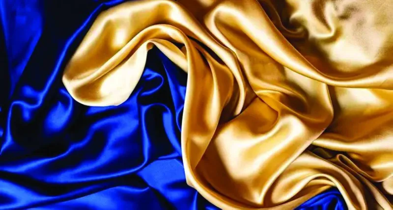 A close-up of a nano silk fabric with a fine fibrous texture designed to reflect sunlight and block ultraviolet rays.