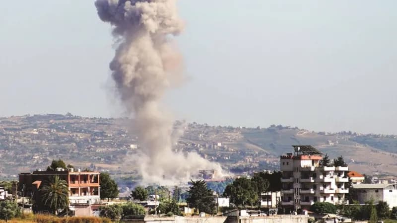 Destruction in southern Lebanon following Israeli air strikes, with damaged buildings visible amid the aftermath of the attacks.