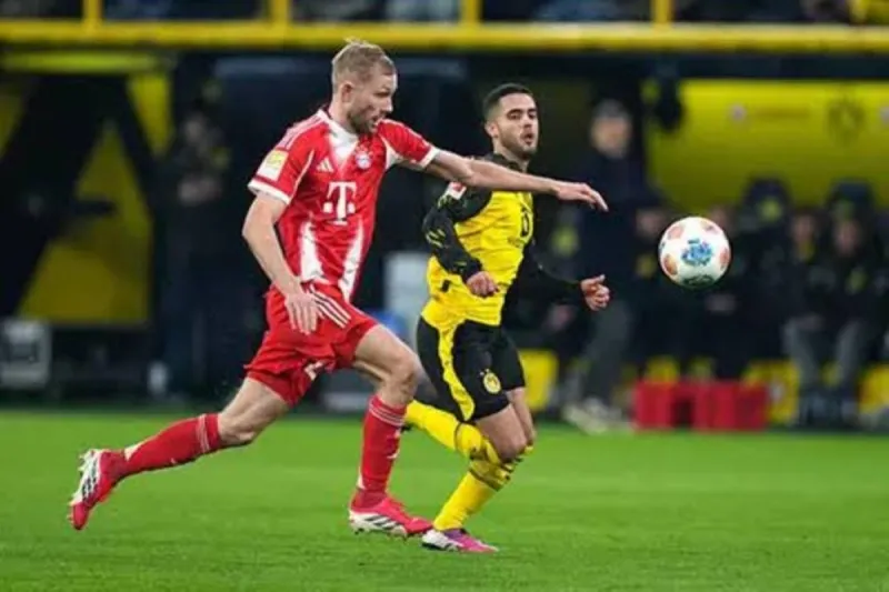 A Bundesliga match in progress, illustrating the professional football environment where new FIFA rule changes will be implemented from July 2025.