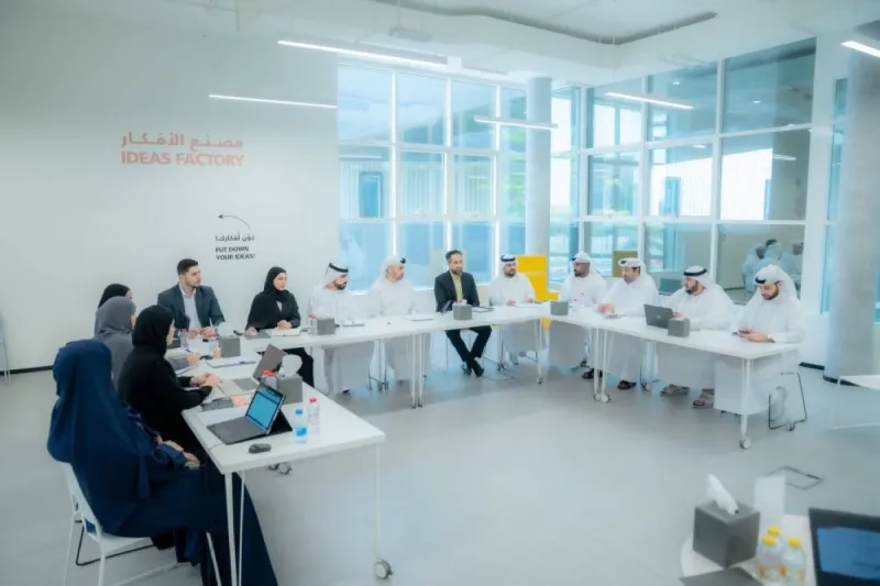 Members of the Supreme Committee of Ajman's 'Sayfuna Saada' summer programme seated at a meeting table during their preparatory session chaired by Ahmed Al Raeesi.