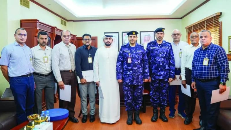 Brigadier Sultan Khalifa Al Muhairi honouring outstanding employees of the Ajman Police Financial Affairs Department at a recognition ceremony.