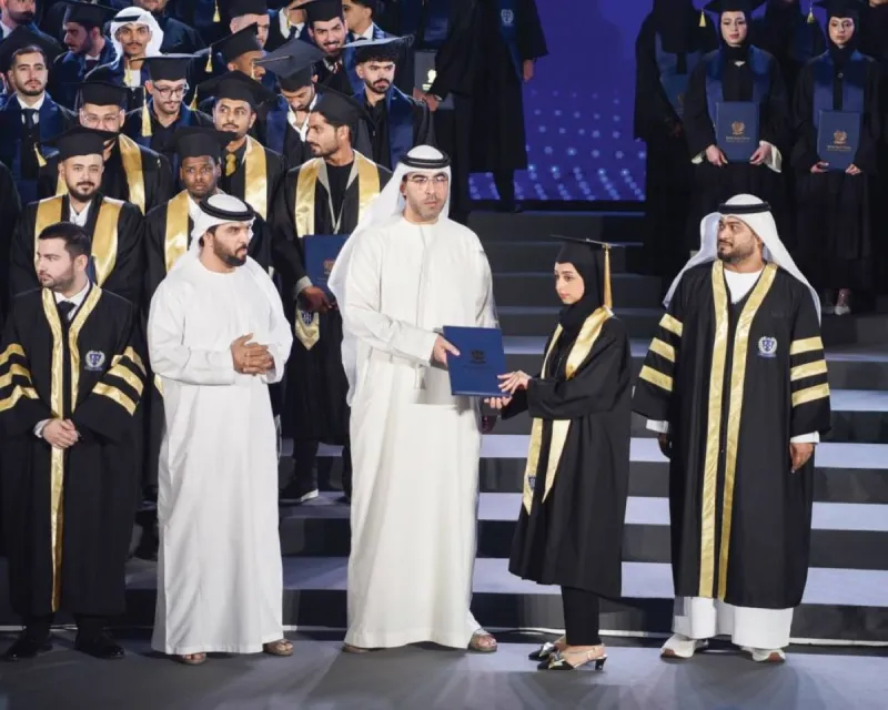Sheikh Ahmed bin Saud bin Rashid Al Mualla presenting graduation awards to students of the 'Pride and Eminence' cohort at the British Applied College ceremony in Umm Al Quwain.