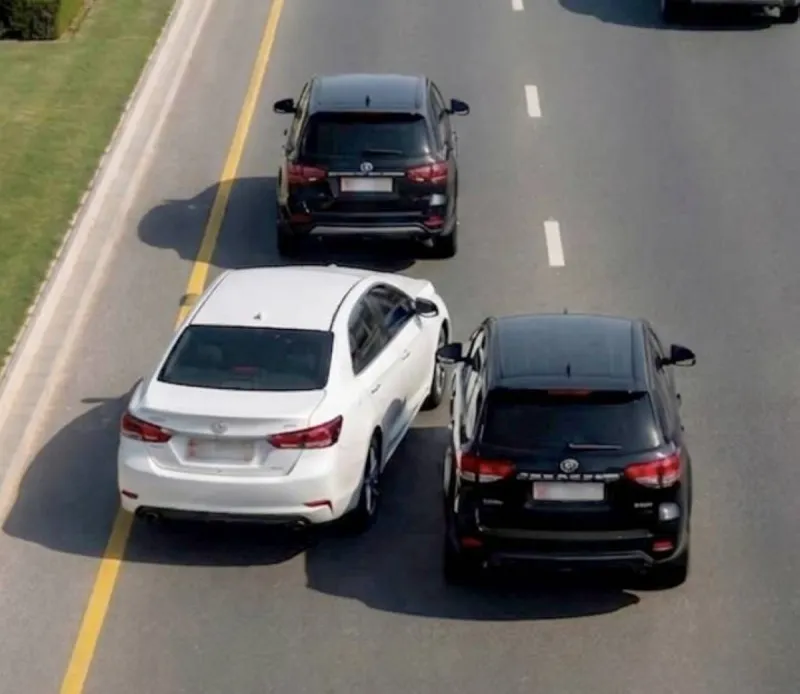 A vehicle on a public road in Abu Dhabi, illustrating a reckless driving case that resulted in a criminal conviction.