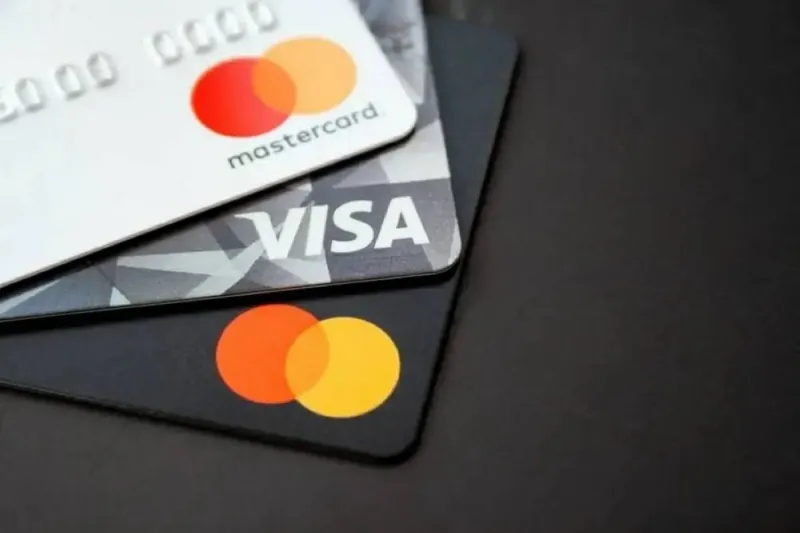 Logos of Visa, Mastercard, and Coinbase displayed alongside the Open Standard stablecoin network branding.