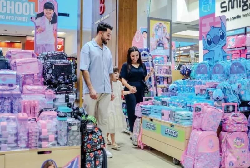 A promotional display for the Shopping Malls Group 'Shop, Win & Go' summer campaign featuring EXEED LX cars as prizes.