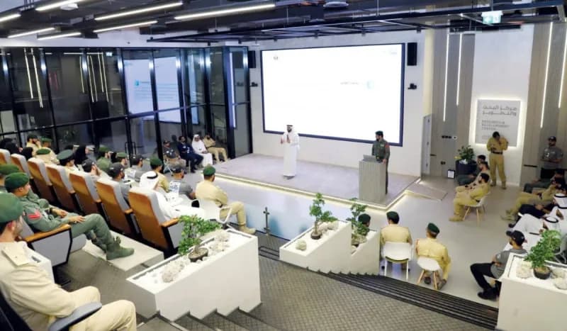 Officers and employees attending Dubai Police's Knowledge and Innovation Projects Programme workshop at the Research and Development Theatre.