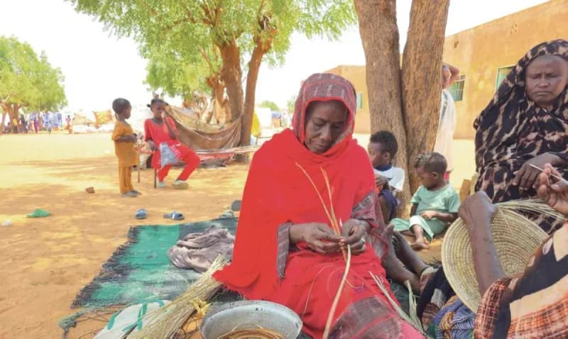 Displaced civilians in Sudan gather in a temporary shelter amid the ongoing armed conflict.