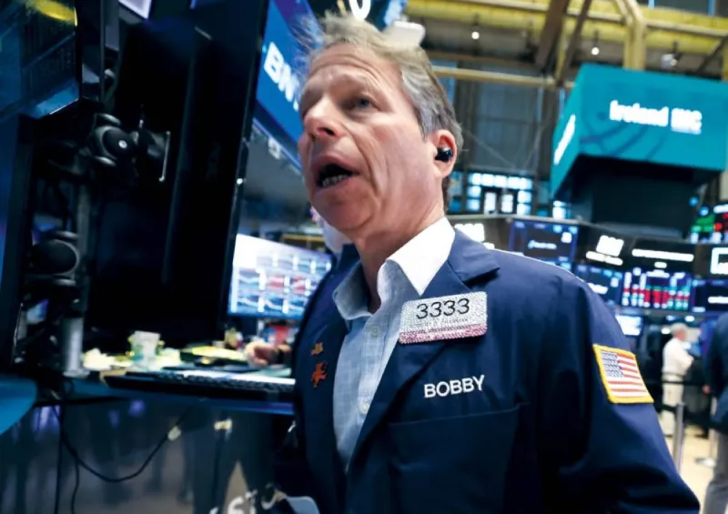 A stock market trading screen displaying falling global indices amid renewed US-Iran tensions.