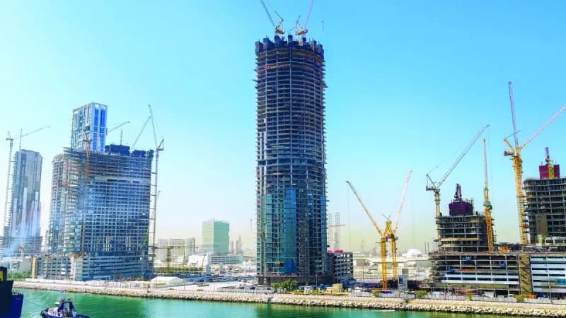 The Harbour Lights residential tower under construction in Dubai Maritime City, with its 52-storey structural framework fully completed.