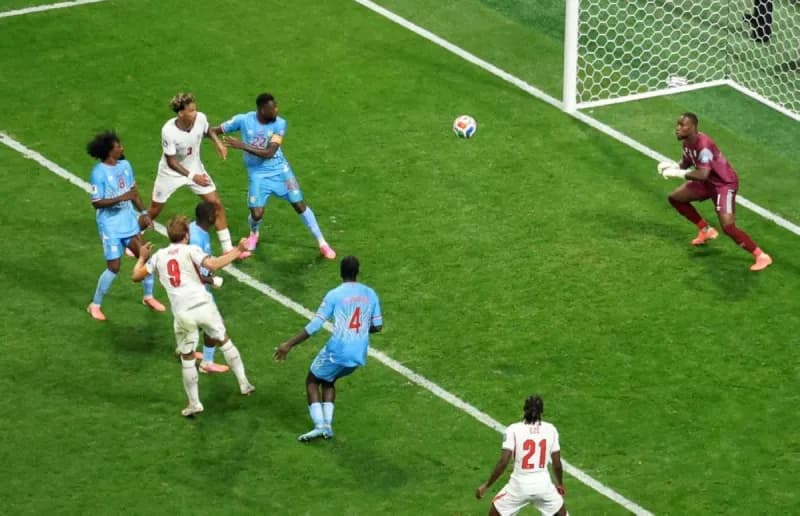 England players celebrate after scoring against the Democratic Republic of Congo in their World Cup round of 32 match.