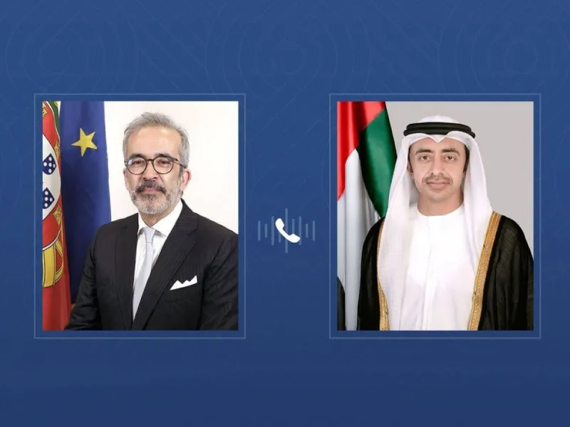 Sheikh Abdullah bin Zayed Al Nahyan speaking on a phone call during a diplomatic meeting.
