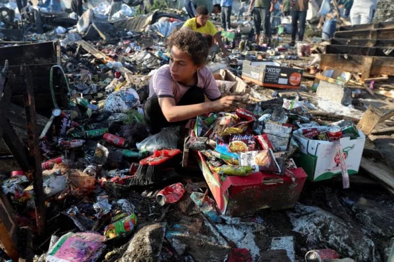 Aerial view of Gaza city showing widespread destruction, with buildings reduced to rubble across densely populated residential areas.