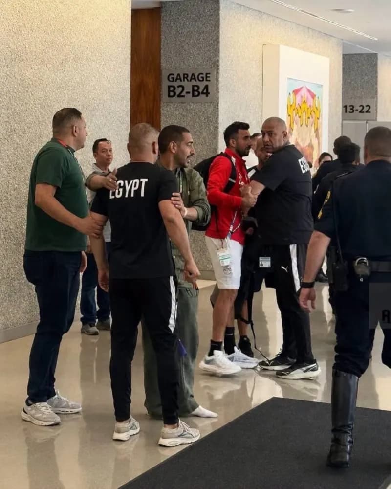 Egypt national team manager Ibrahim Hassan intervening during a confrontation with security personnel at the team's hotel base.