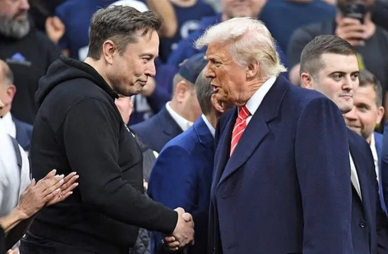 US President Donald Trump speaks alongside Elon Musk at a public event, reflecting their high-profile political and business alliance.