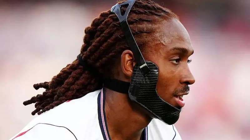 Austria defender Stefan Posch wearing a black jaw brace during a 2026 FIFA World Cup match.