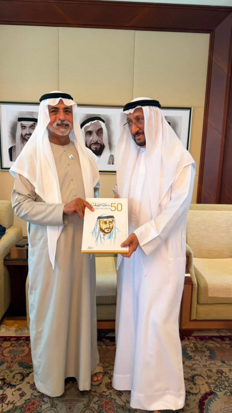 Sheikh Nahyan bin Mubarak Al Nahyan receives a copy of the book 'Sultan Saqr... 50 Years with Emirati Sport' during a meeting at his palace in Abu Dhabi.
