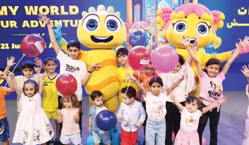 Colourful signage and characters from the 27th edition of Alam Mudhish at the Dubai World Trade Centre, featuring Baby Shark alongside Mudhish and Dana.