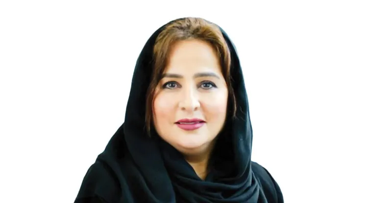 Dr. Amal Al Malla Al Mheiri, consultant in obstetrics and gynaecology and founder of the Her Wellness Way initiative, photographed in a professional setting.