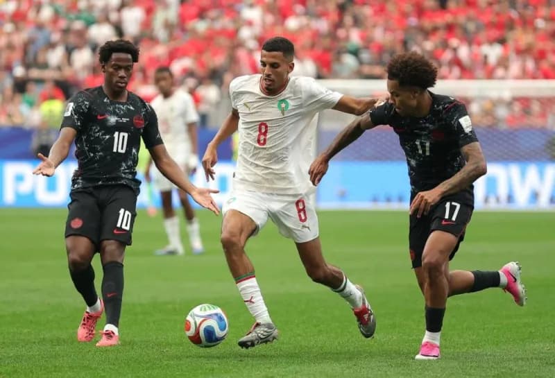 Morocco's players celebrate after defeating Canada 3-0 to advance to the quarter-finals of the 2026 World Cup.