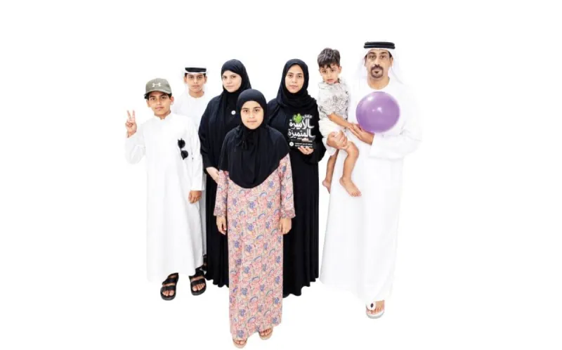 Members of the Al Hantoobi family posing together as part of their volunteer activities with the Shukran Li Ataaik volunteer team in the UAE.