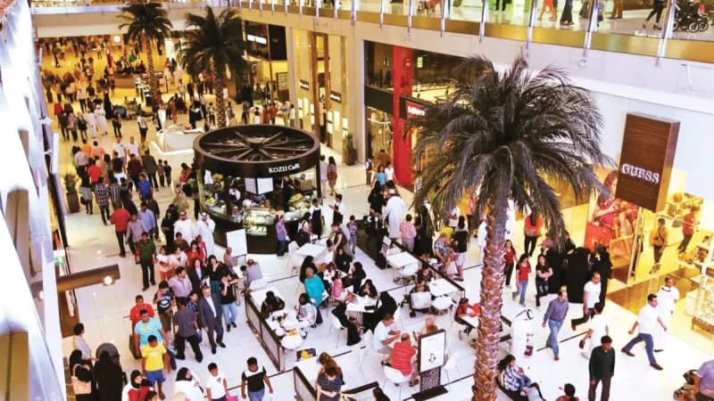 Shoppers and visitors browse displays at a Sharjah Summer 2026 promotional event in one of the emirate's shopping centres.