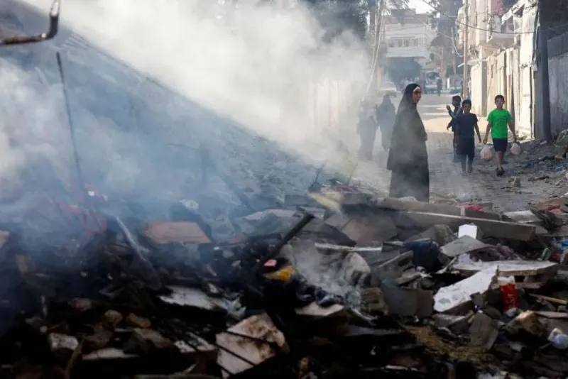 An Israeli airstrike hits a location in Gaza City, with smoke rising over buildings in the northern part of the Strip.