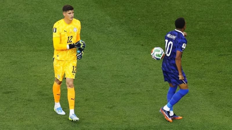 Kylian Mbappé celebrating after scoring the winning penalty for France against Paraguay in the World Cup round of 16.
